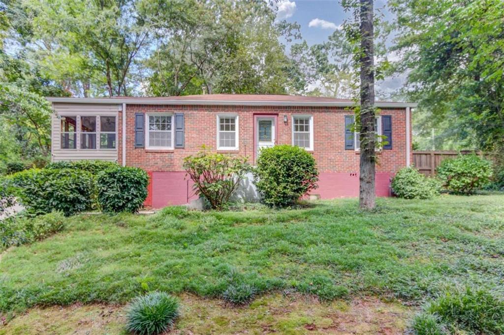 front view of a house with a yard