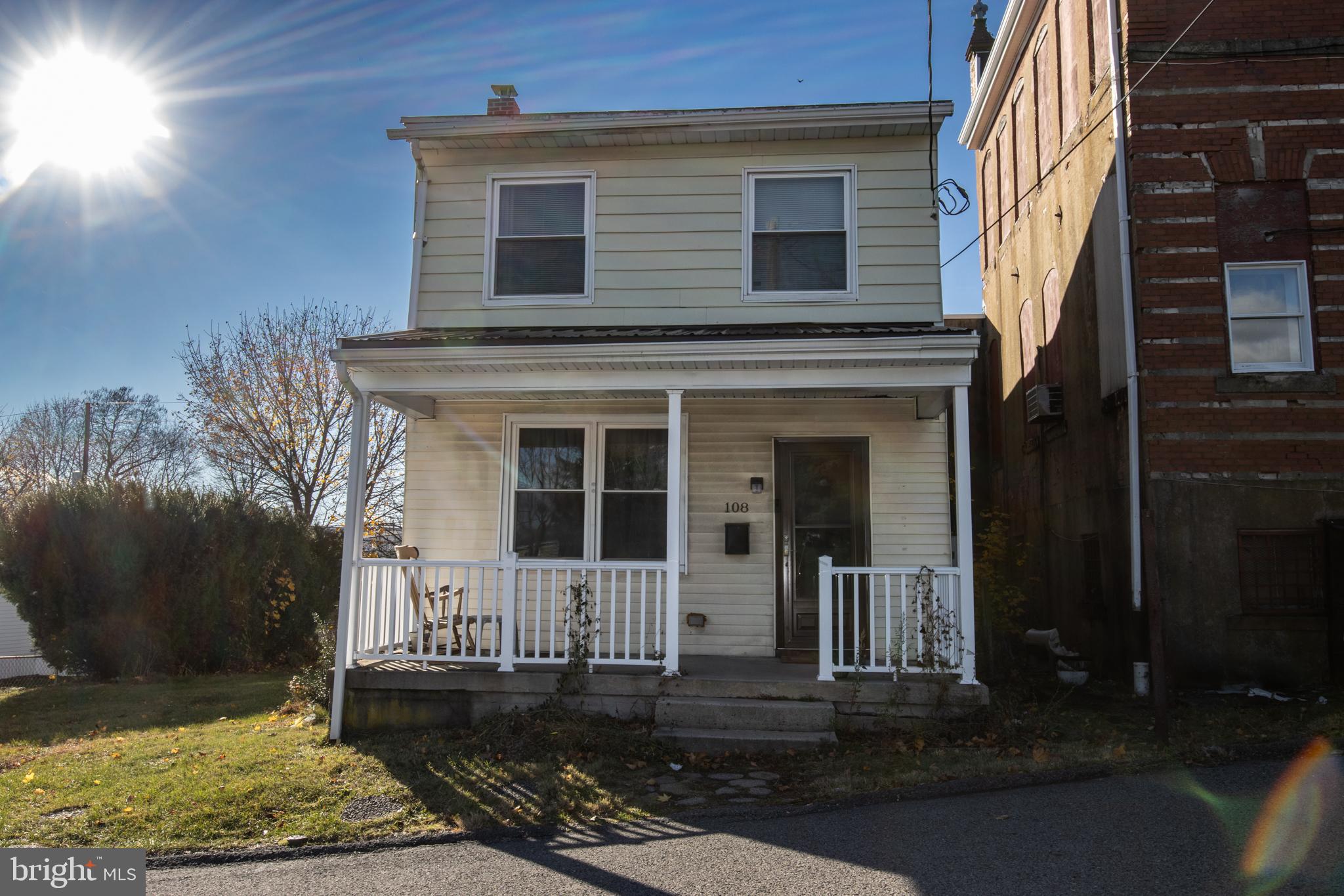 front view of a house with a yard