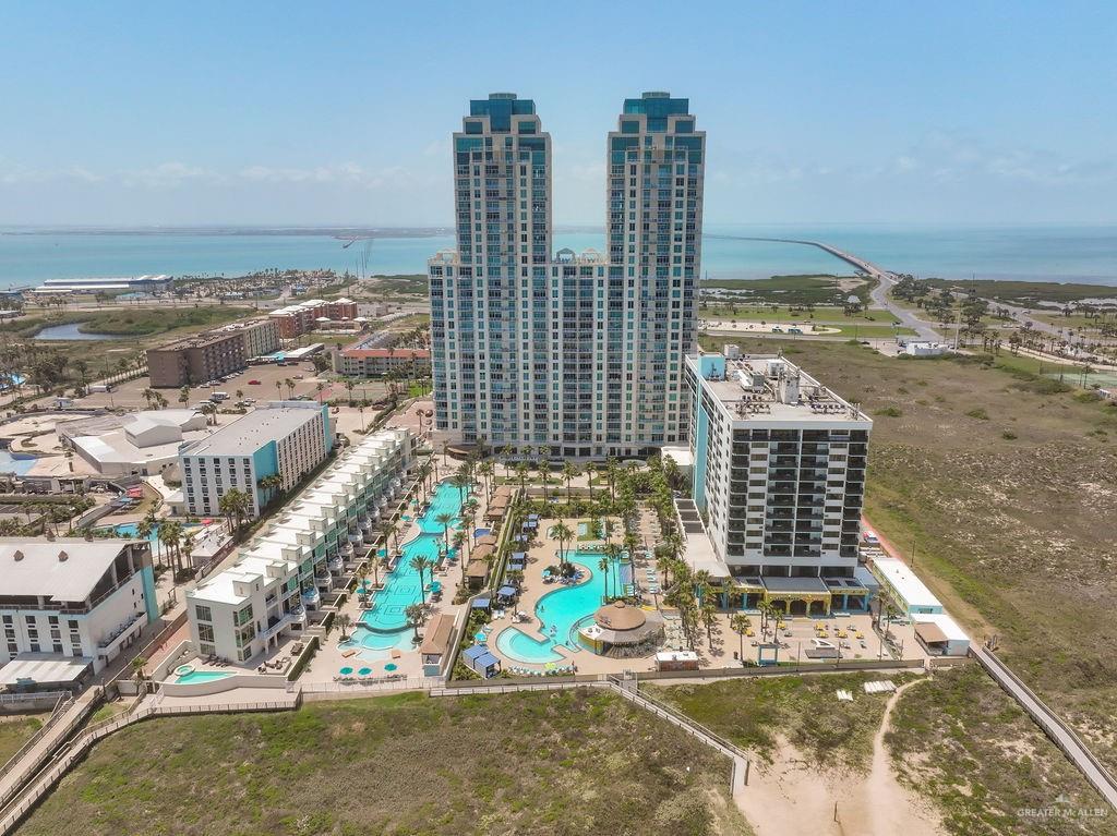 Birds eye view of property with a water view