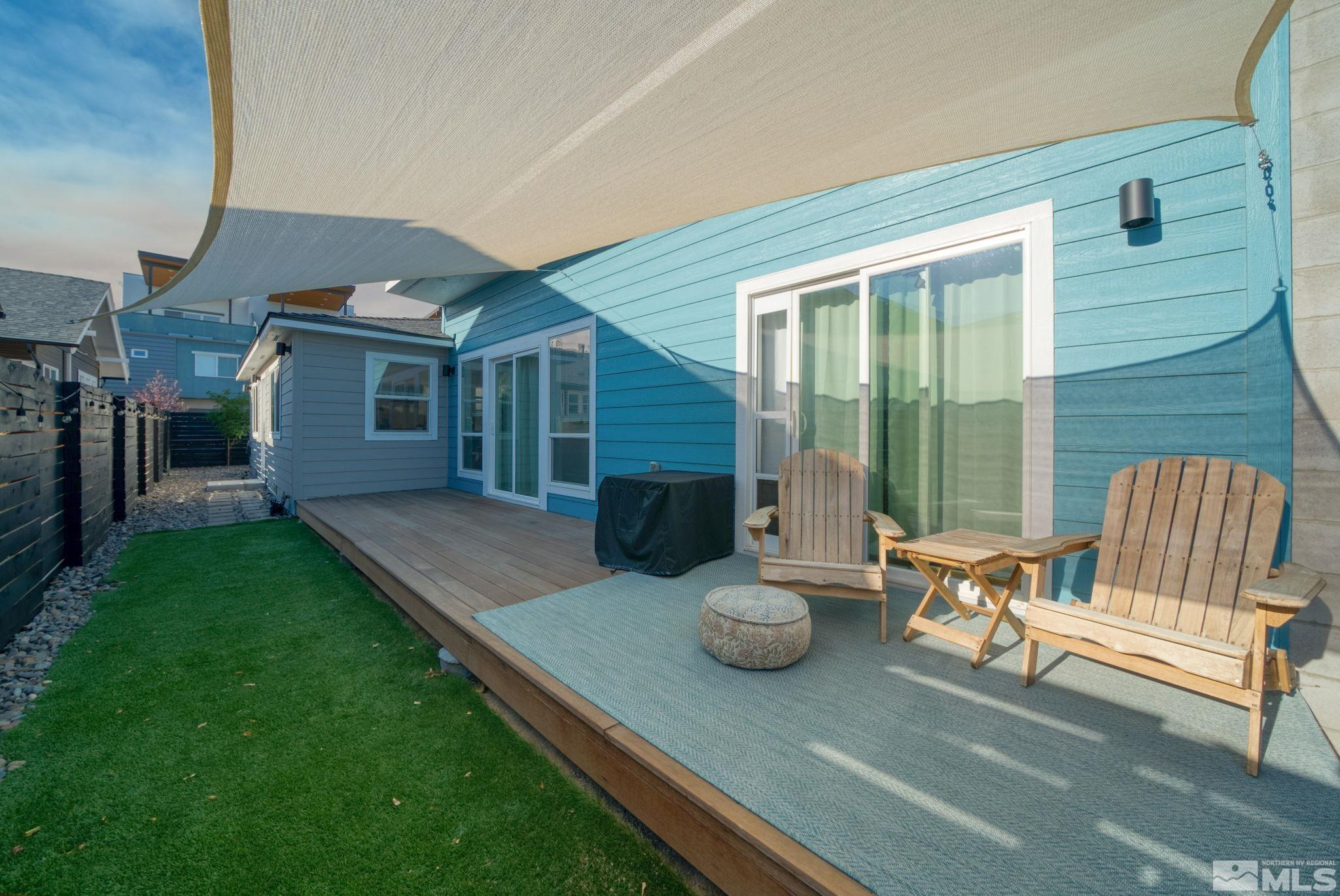 a view of a deck with chair and table