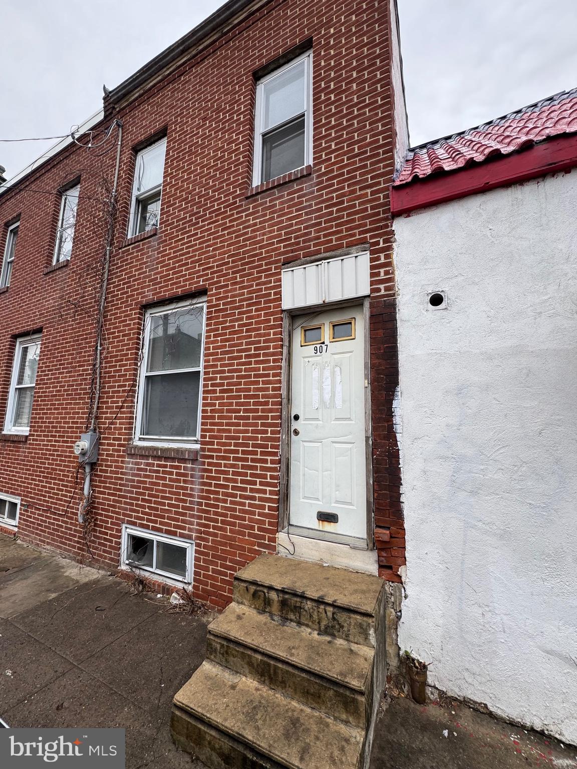 a front view of a house with stairs