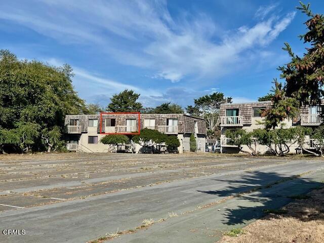 a front view of a building with street view