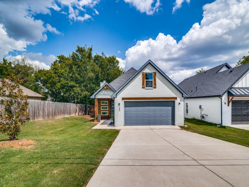 a view of front of house with a yard