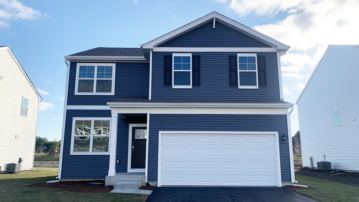 a front view of a house with a garage