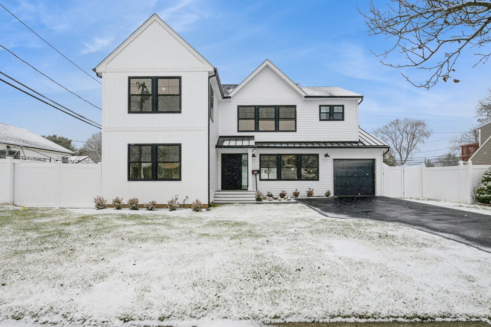 Modern inspired farmhouse with a garage