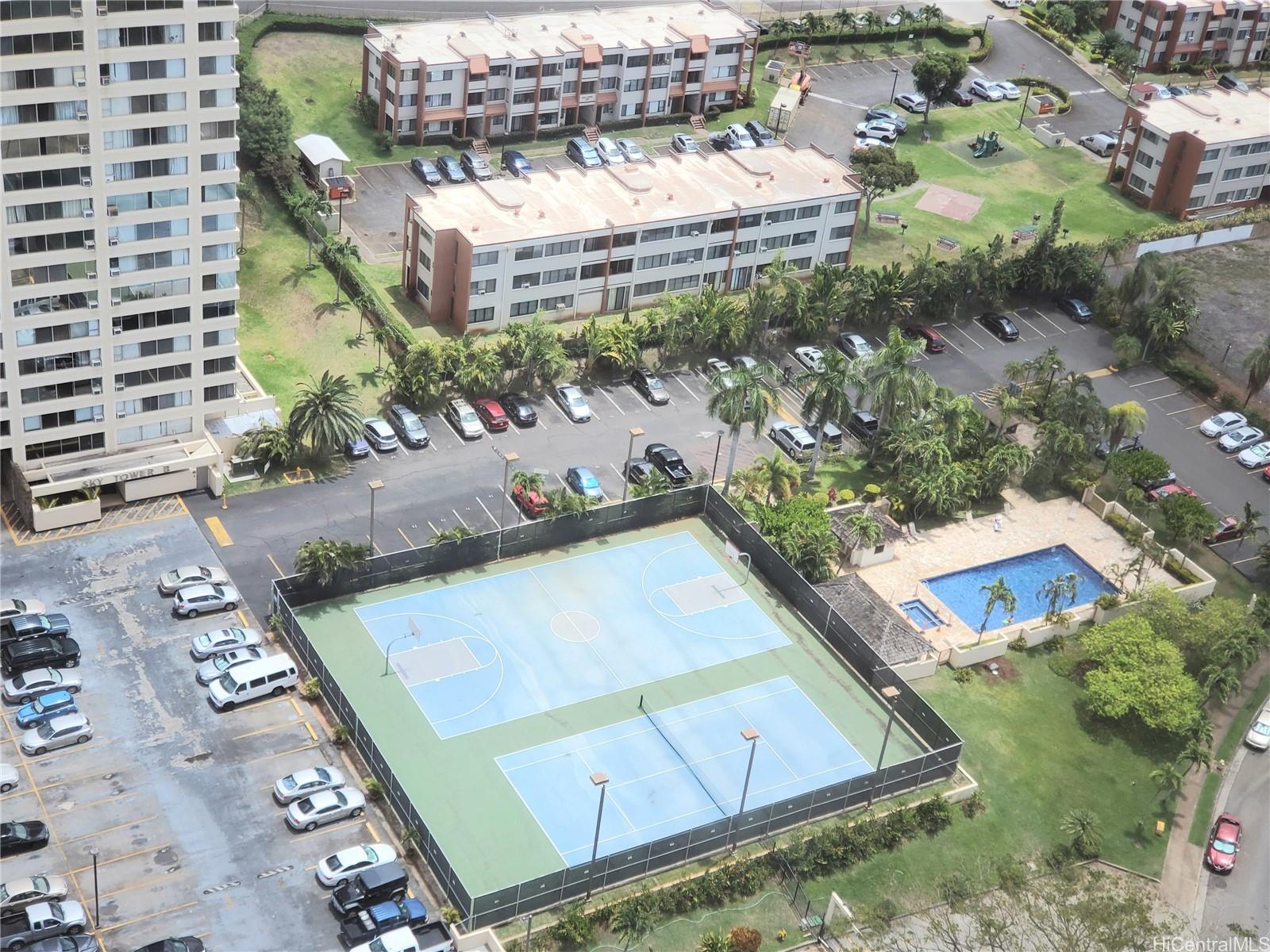 an aerial view of a pool yard and outdoor seating