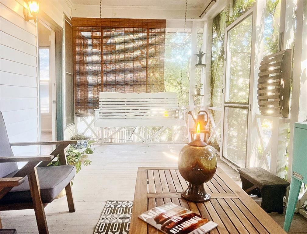 a living room filled with furniture and a large window