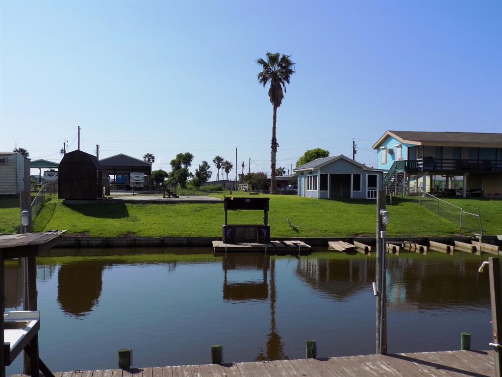 a view of a lake with a house in the background