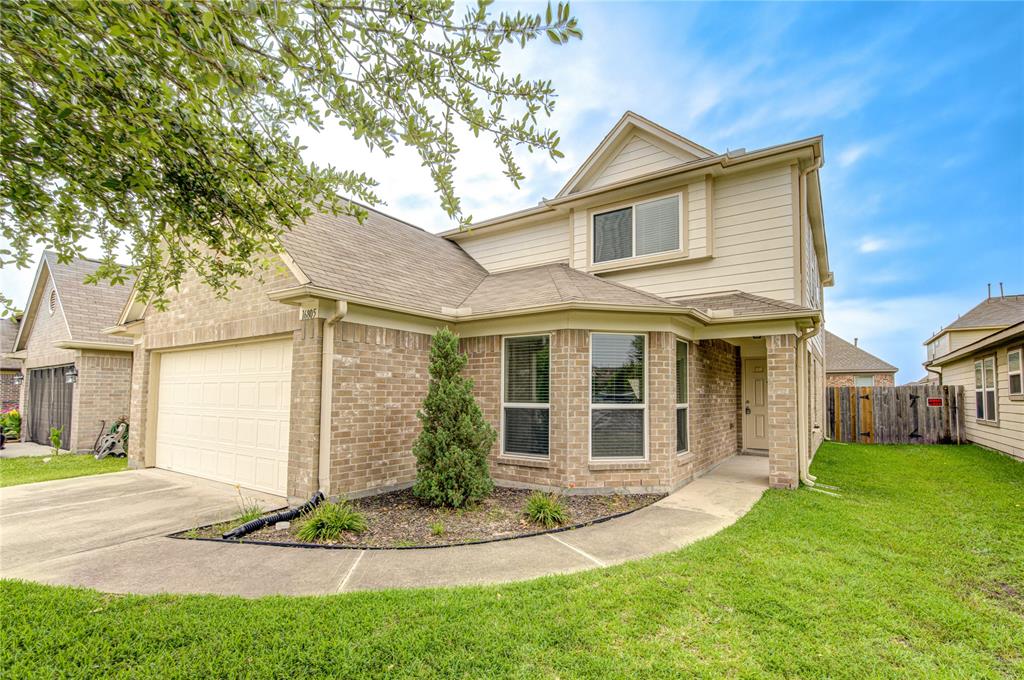 With the lush green grass and beautiful landscaping, this home has lots of curb appeal!'