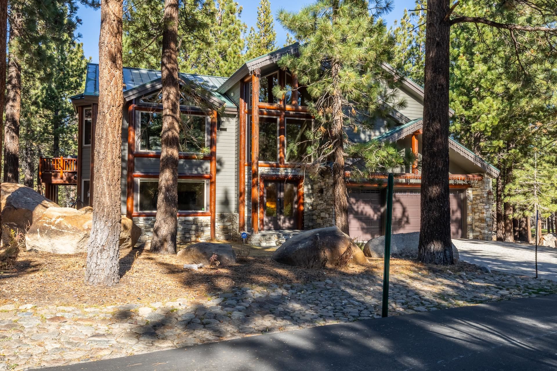 a backyard of a house with lots of tree