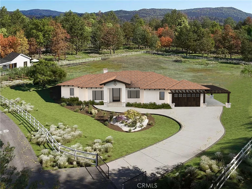 a aerial view of a house with a yard