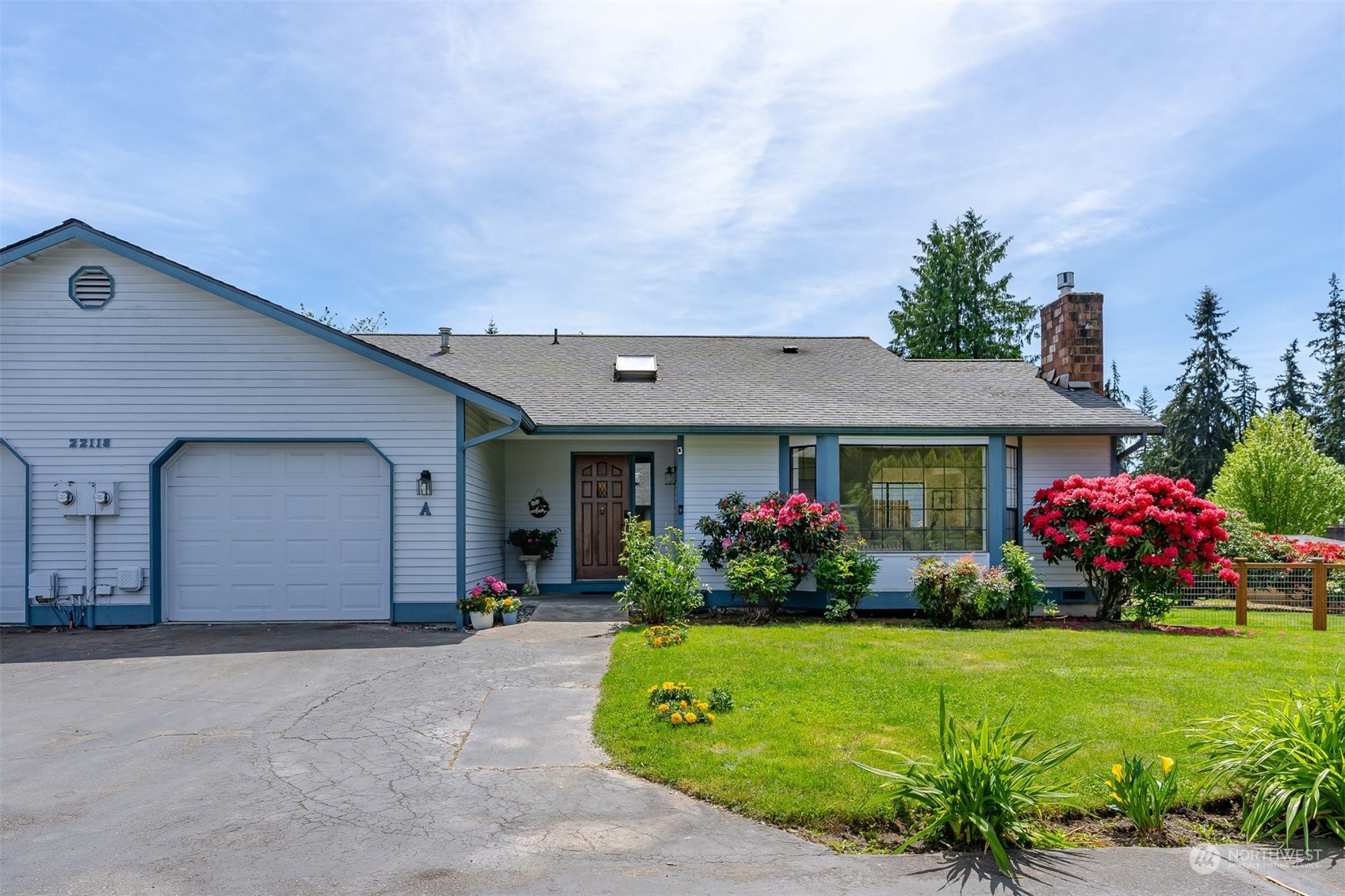 a front view of house with outdoor space and garden