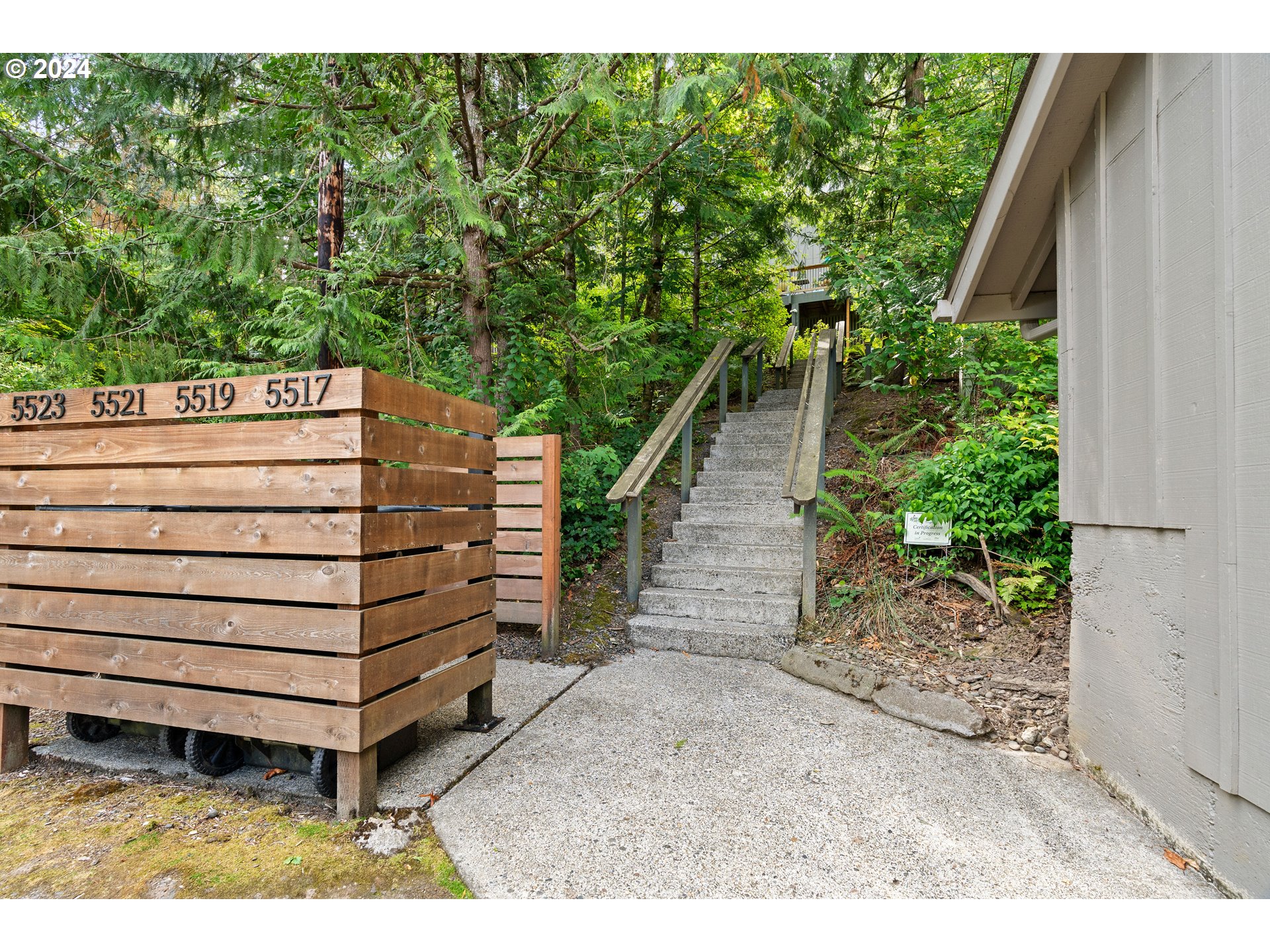 a view of a backyard with plants