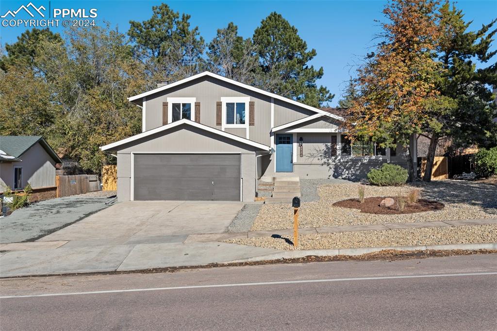 View of front of property featuring a garage