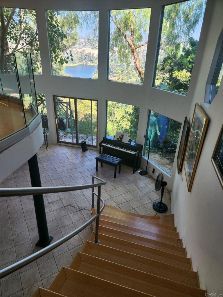 a living room with furniture a window and flat screen tv