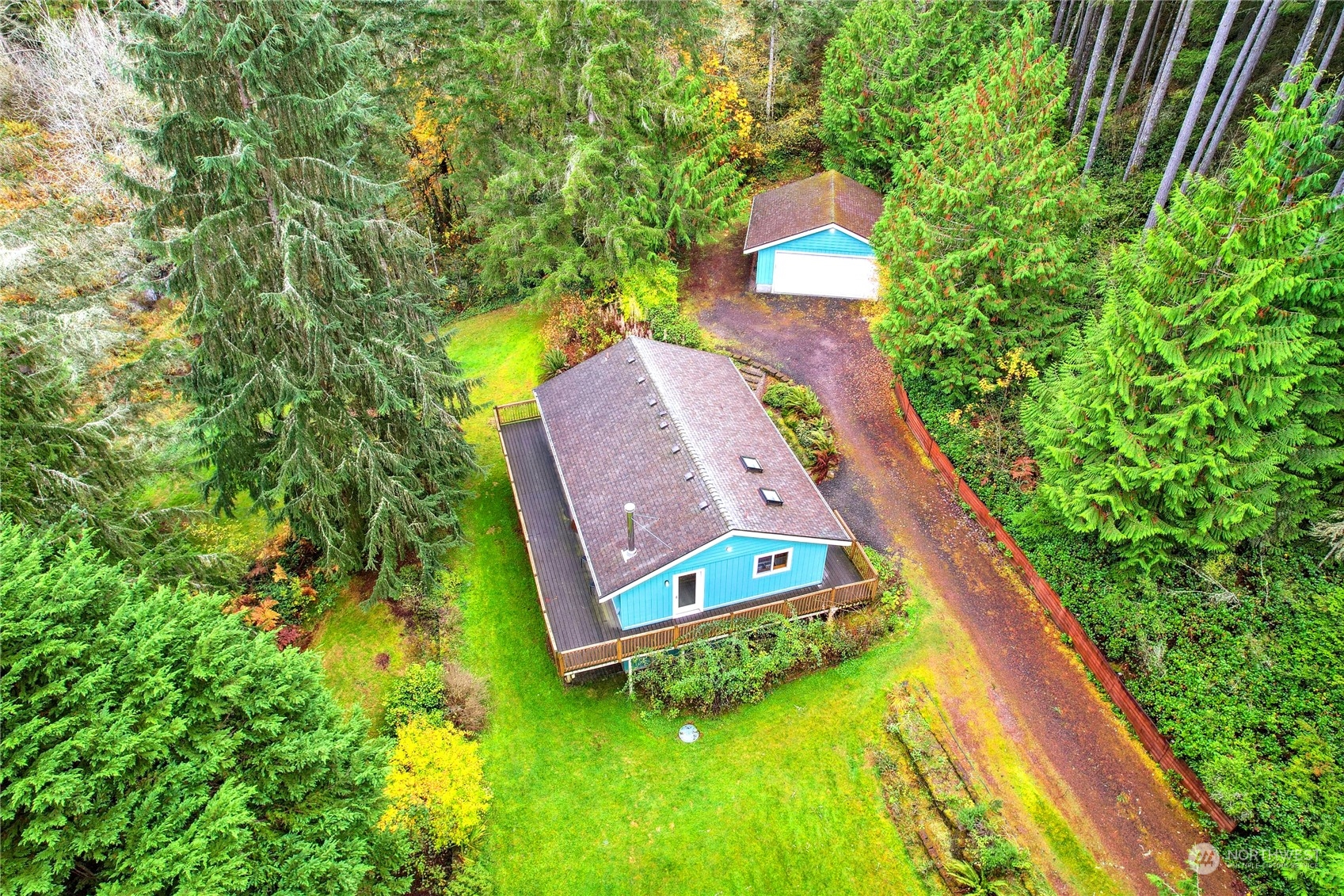 an aerial view of a house with a swimming pool