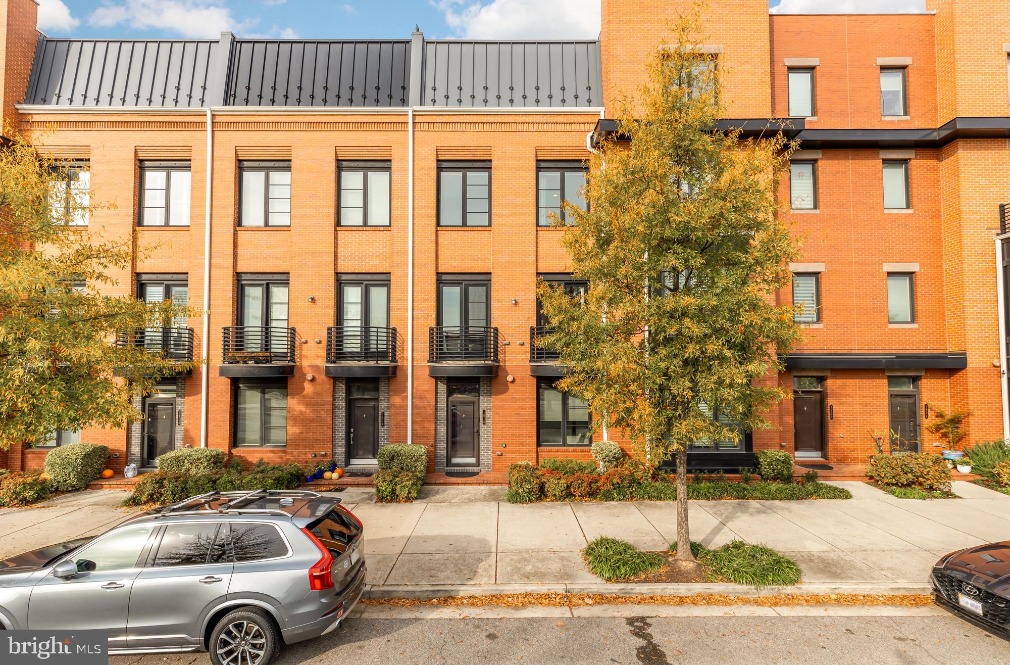 a front view of a building with parking space