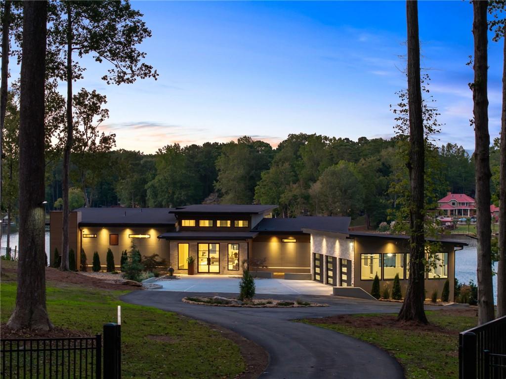 a view of a big yard next to a house with a fountain