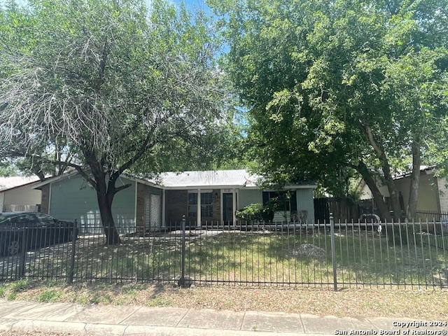 a front view of a house with a small yard