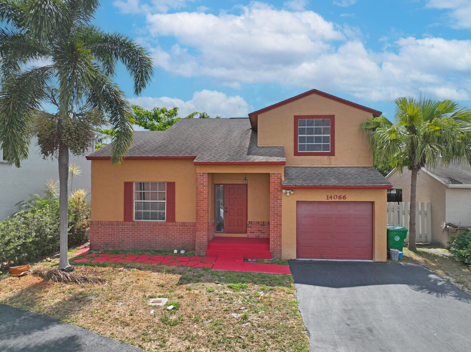 a front view of a house with yard