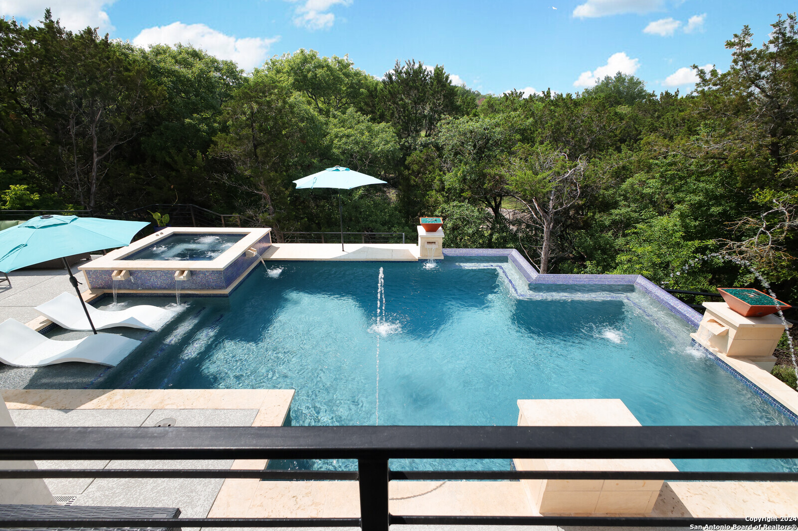 a view of swimming pool from a balcony