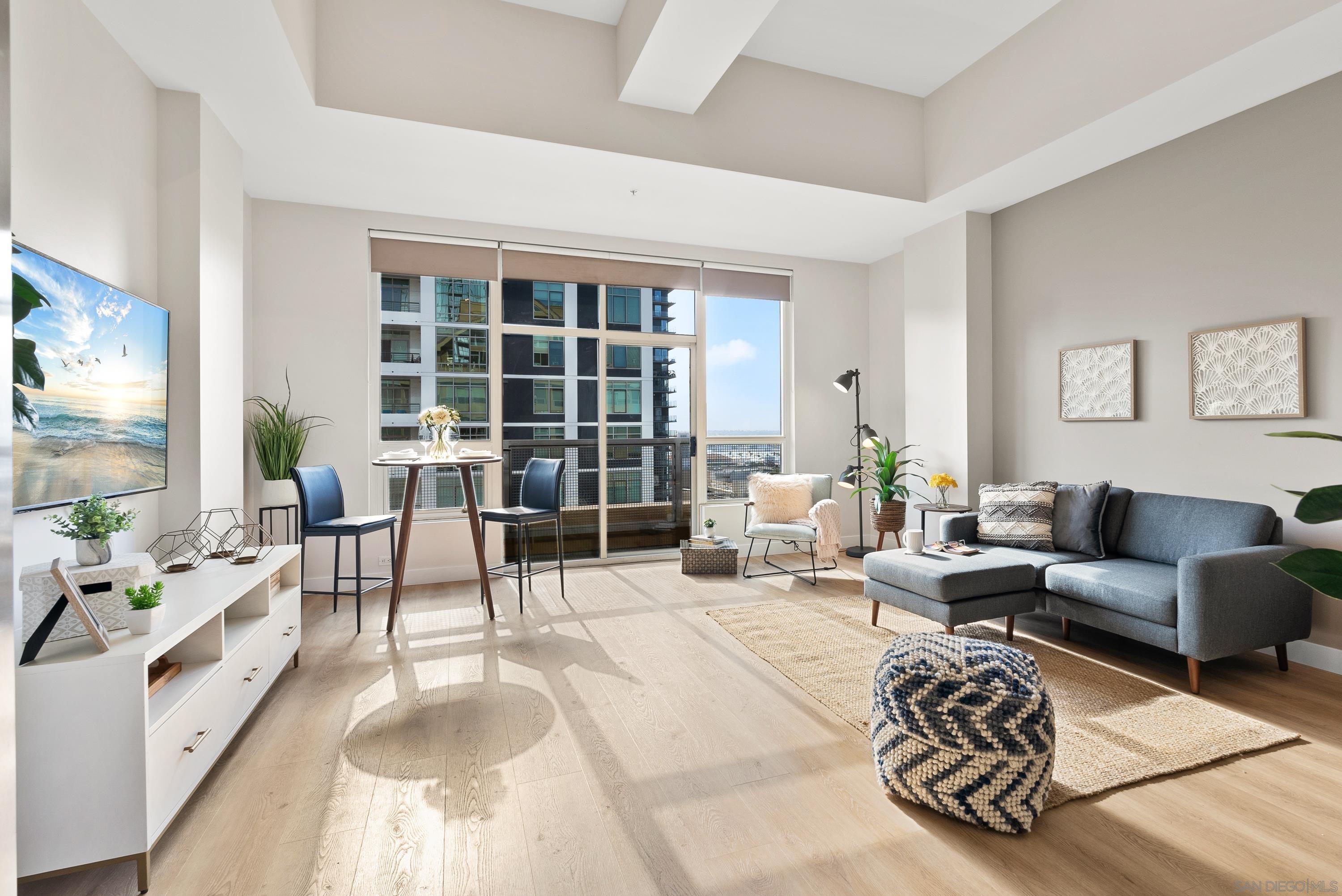 a living room with furniture and a large window