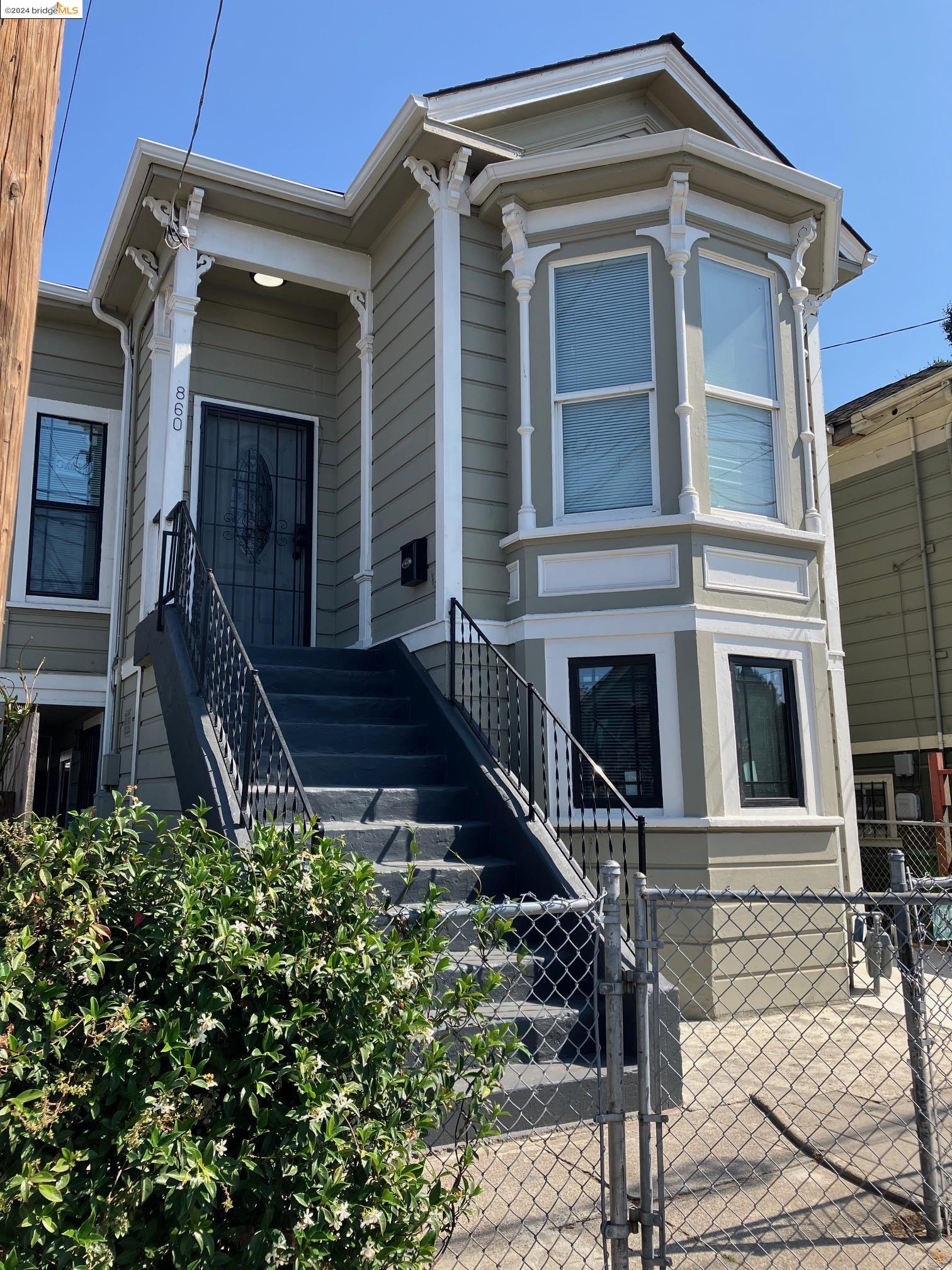 a front view of a house with stairs