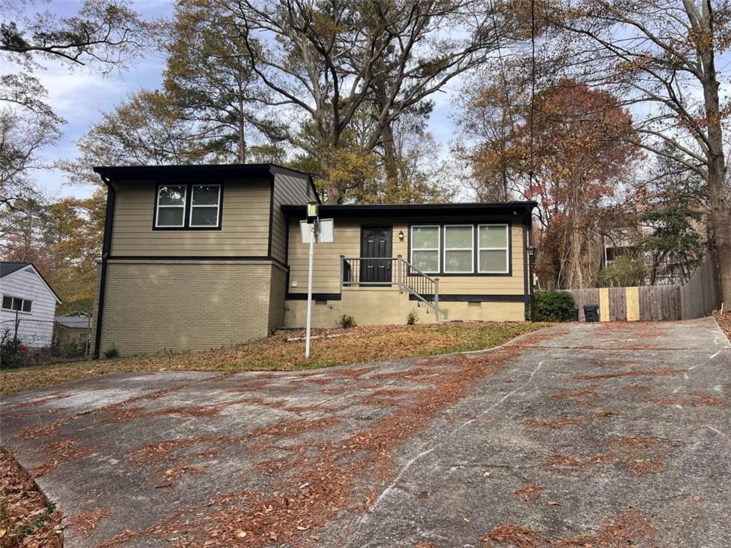 a house with trees in front of it