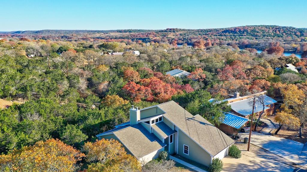 an aerial view of a house with a yard