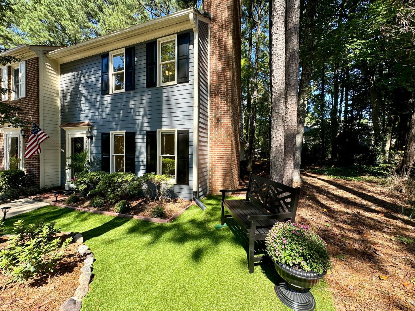 a front view of a house with garden