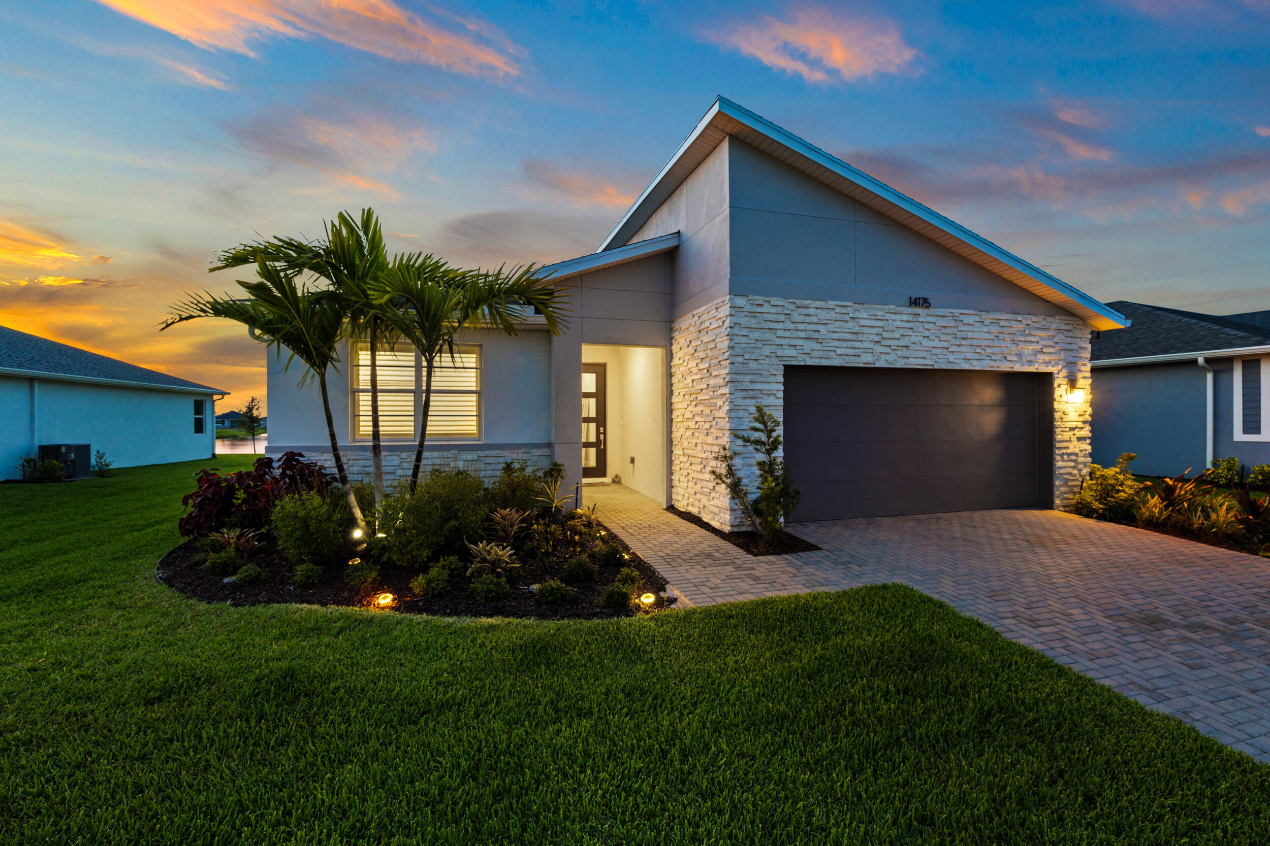 a front view of house with yard and outdoor seating