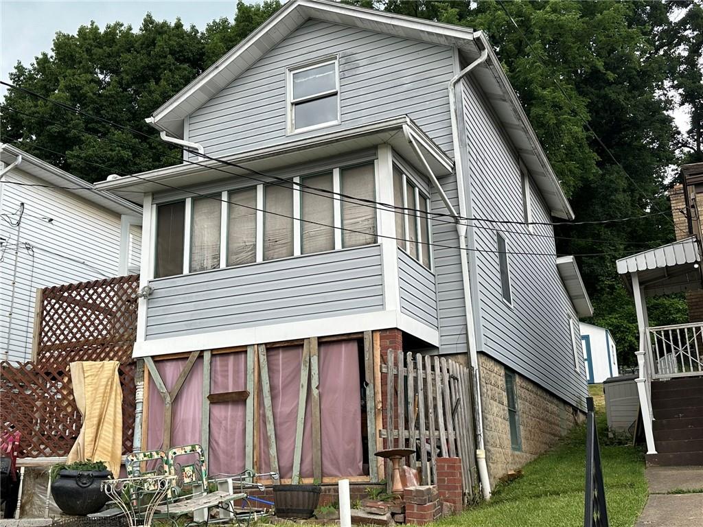 a front view of a house with balcony