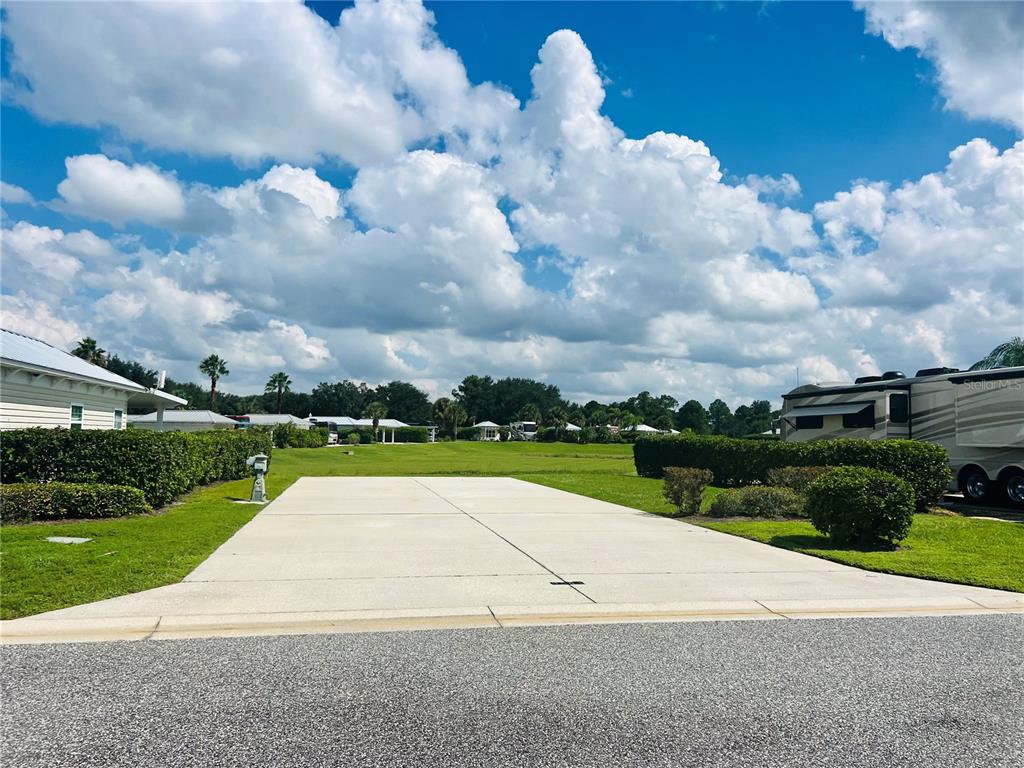 a view of a park with houses