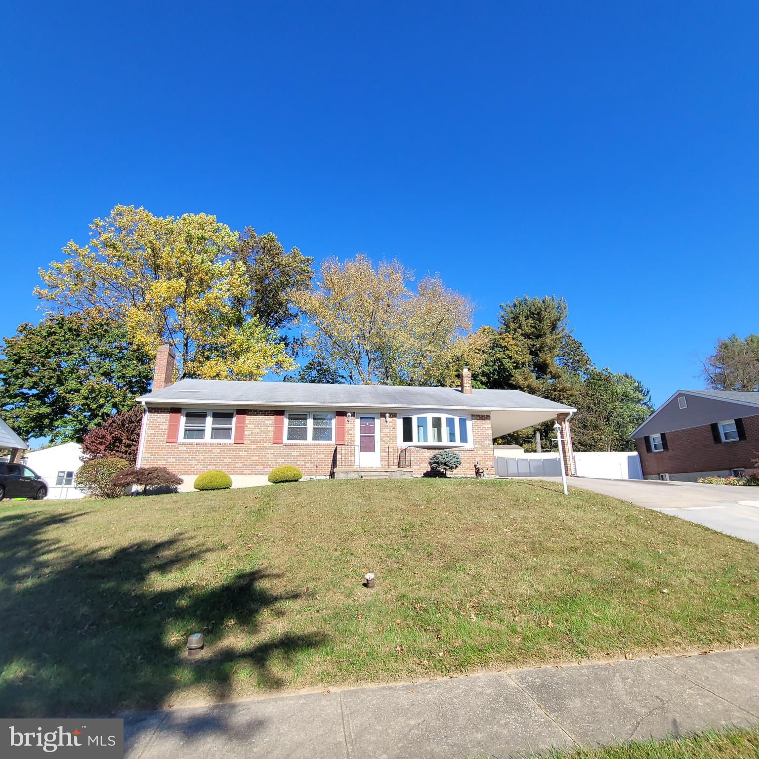 a view of a house with swimming pool and porch