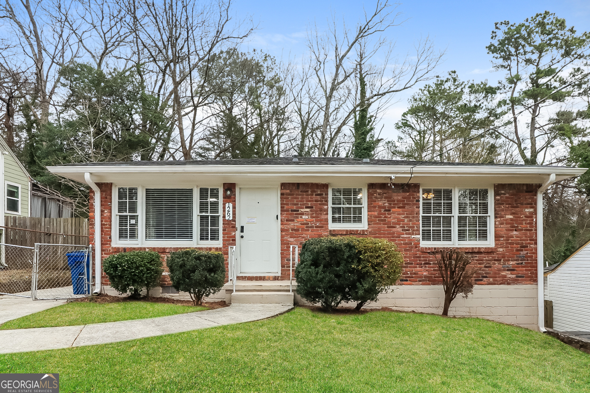 front view of a house with a yard