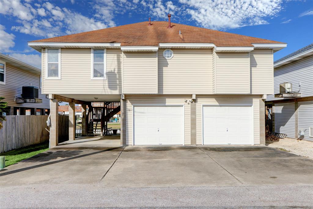 a view of a house with a parking space