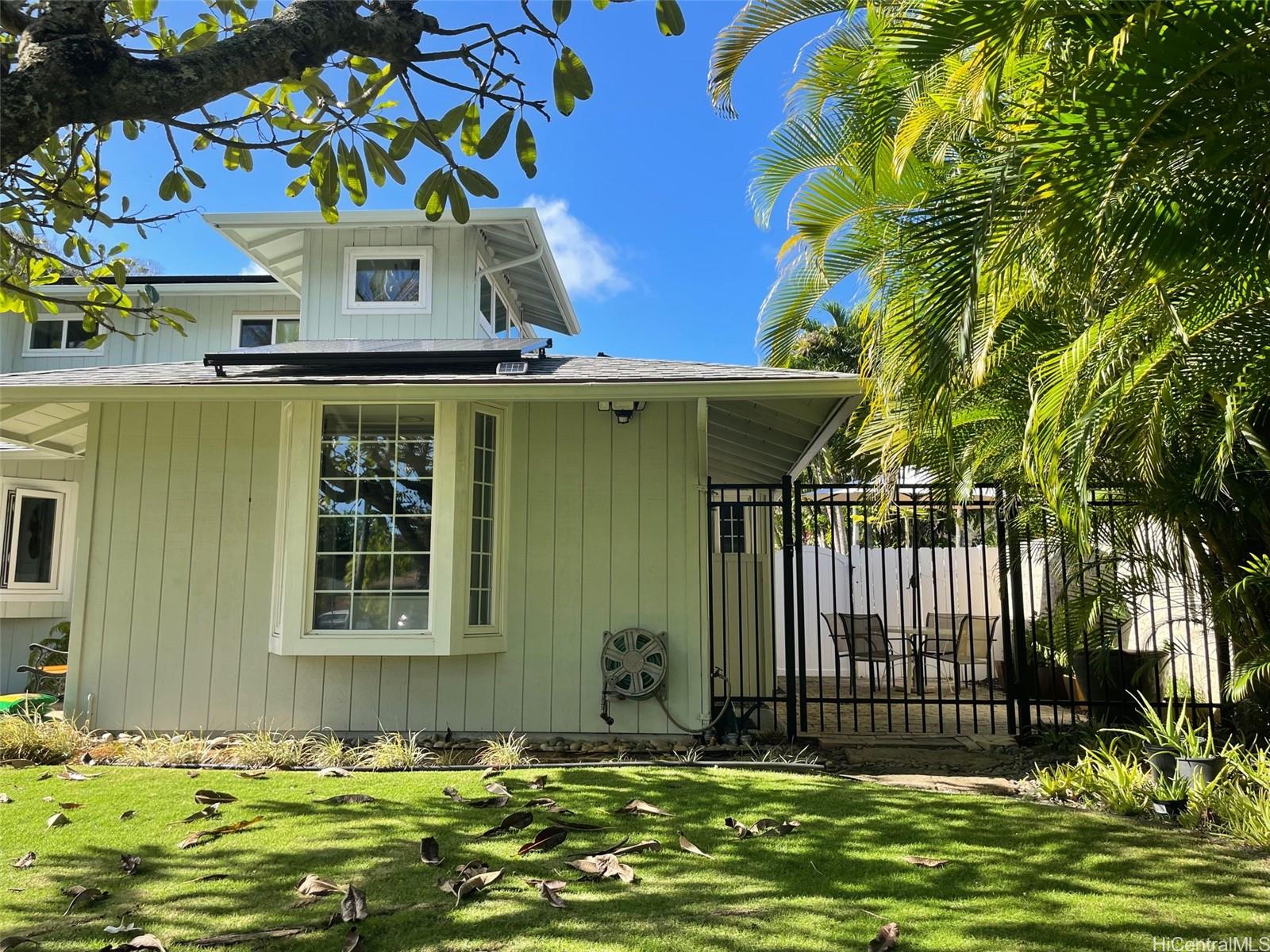 a view of a house with a small yard