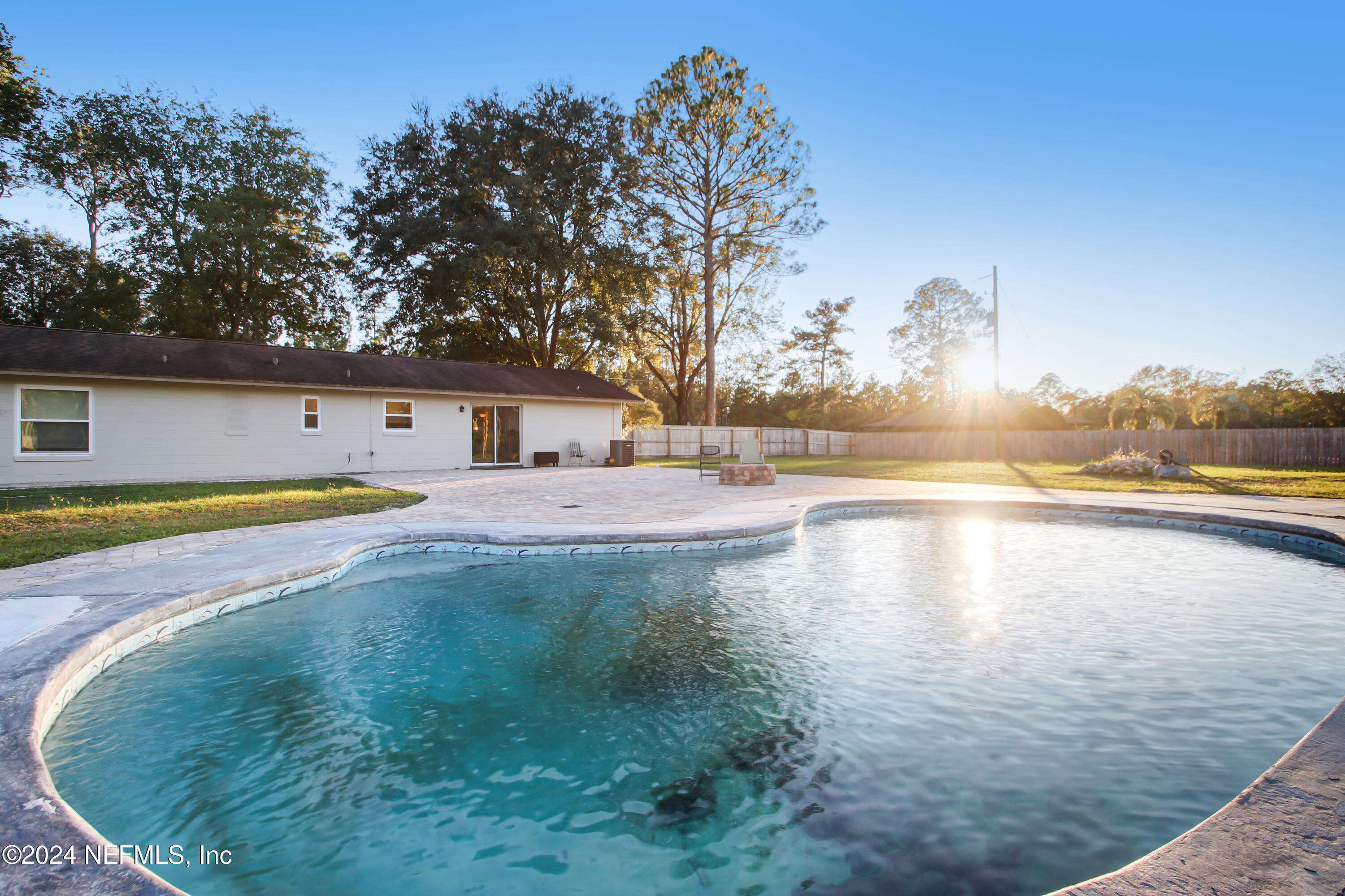 a view of a swimming pool with an outdoor space