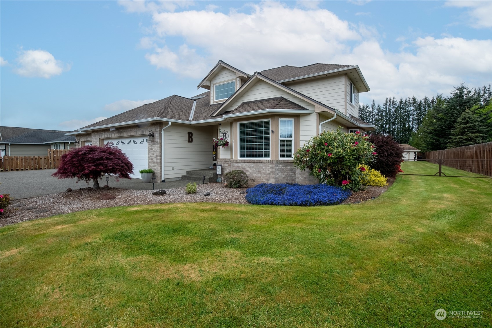 a front view of house with yard and green space