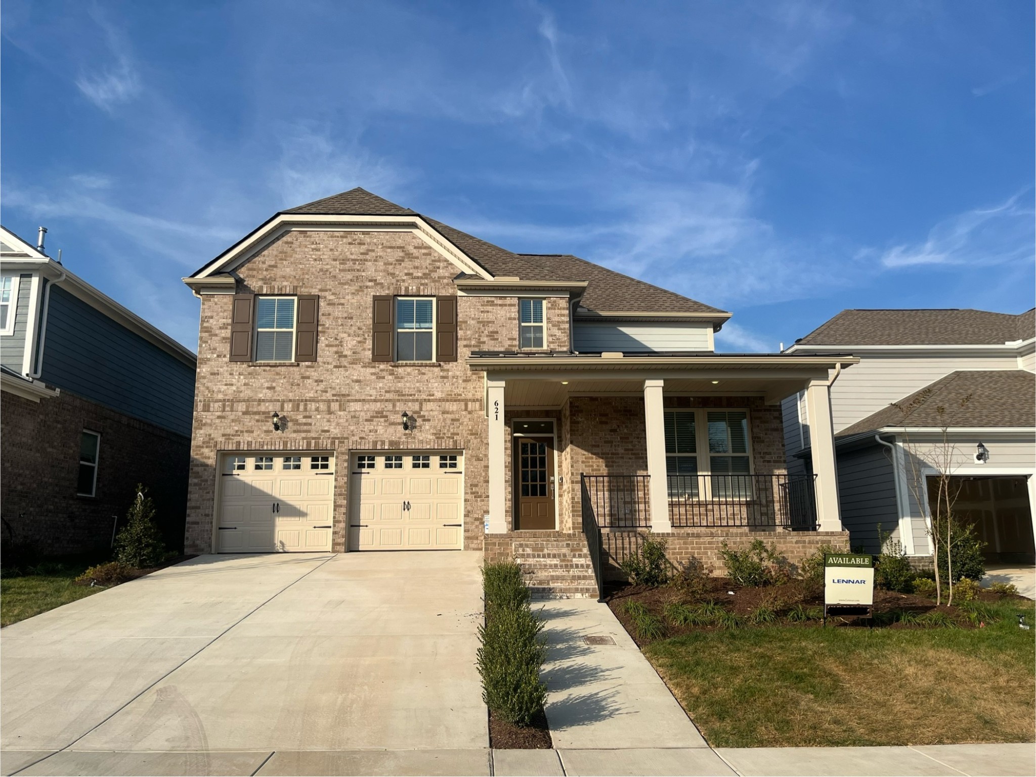 a front view of a house with a yard