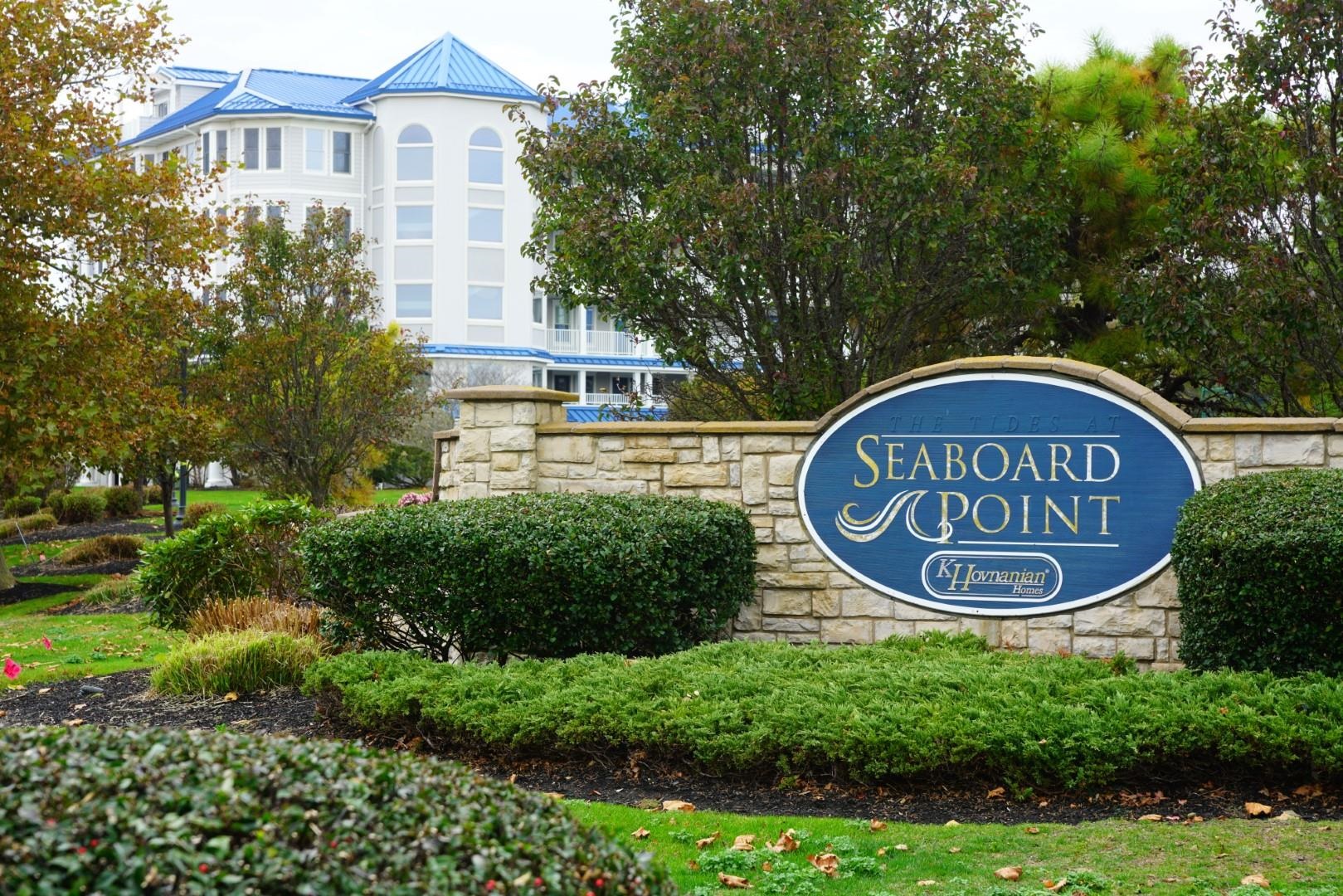 a view of a sign of a park next to a road