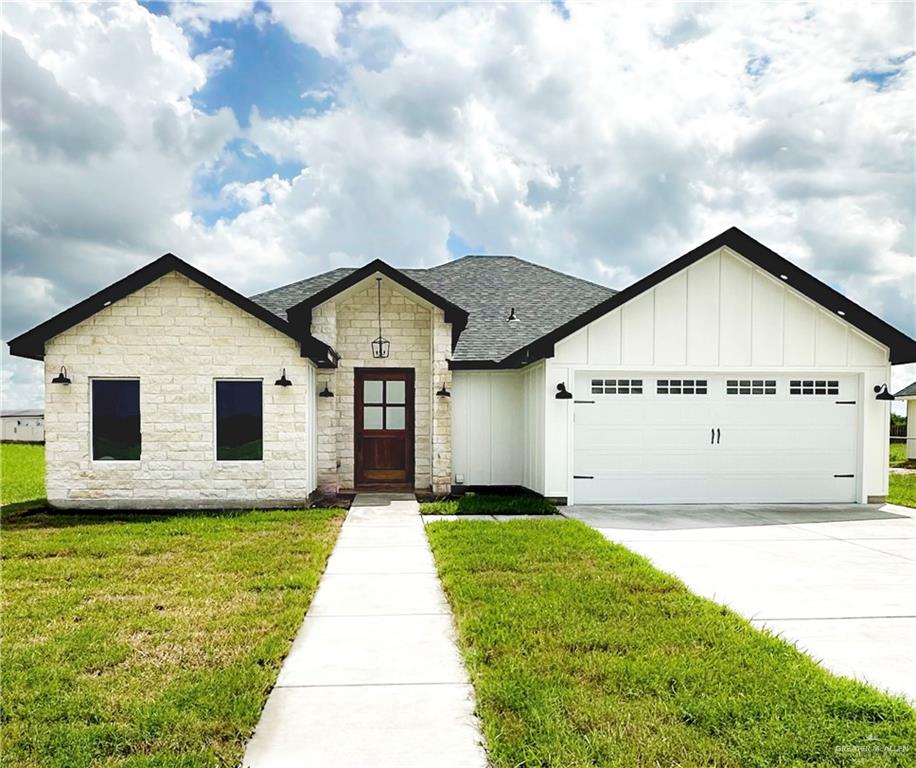 a view of house with yard and entertaining space