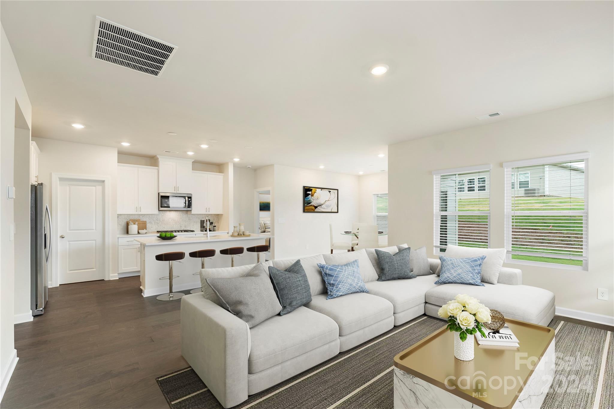 a living room with furniture and a window