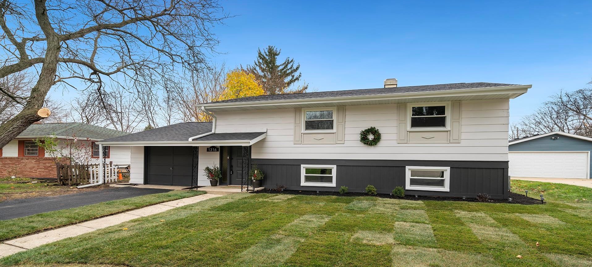 a front view of a house with yard