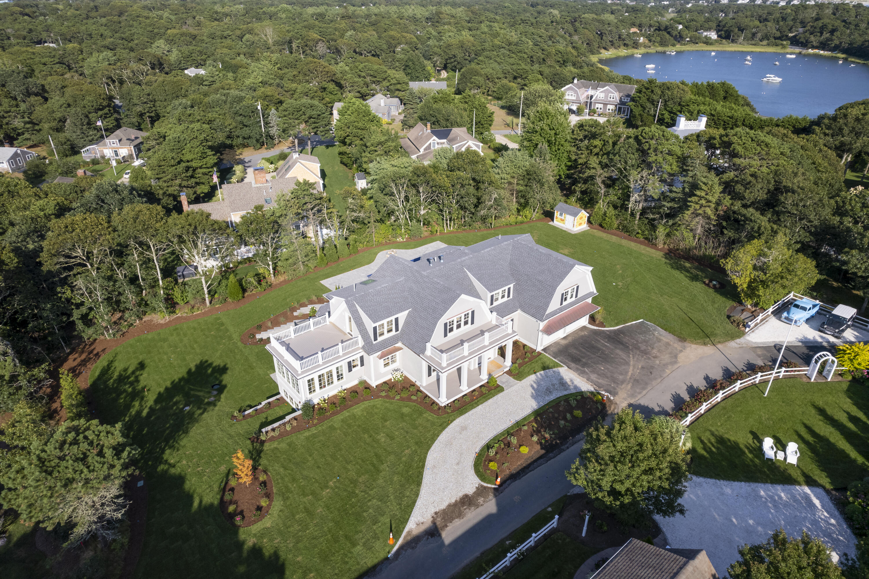 an aerial view of a house with a lake view