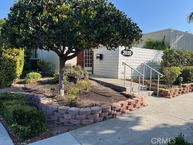 a view of a house with a tree in the background