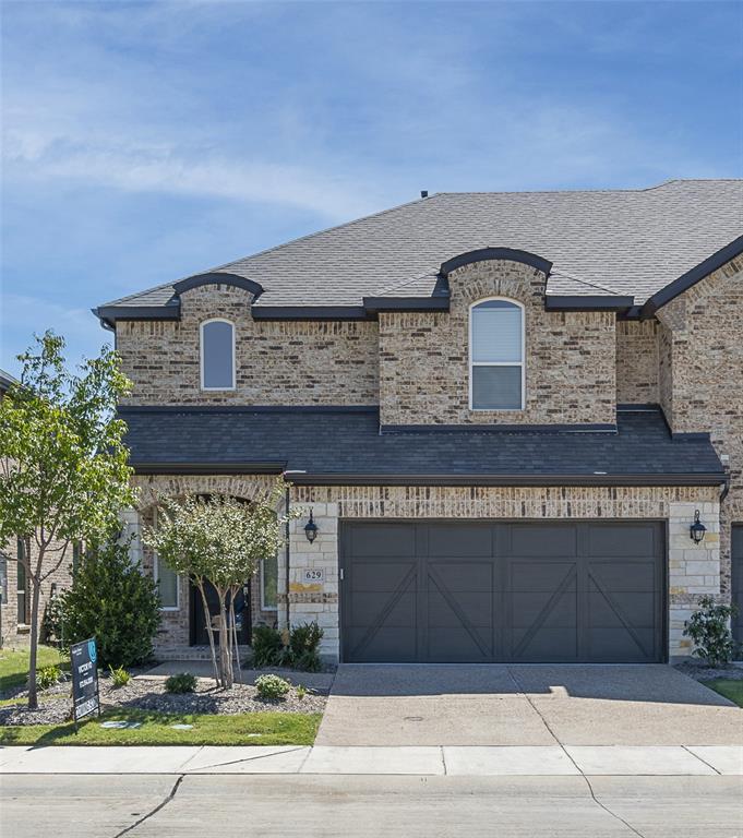 a front view of a house with a garage