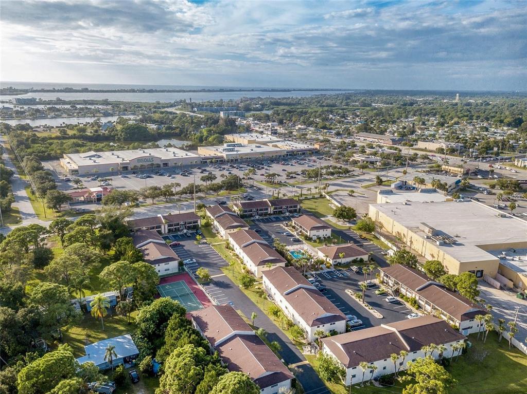 an aerial view of residential building with yard