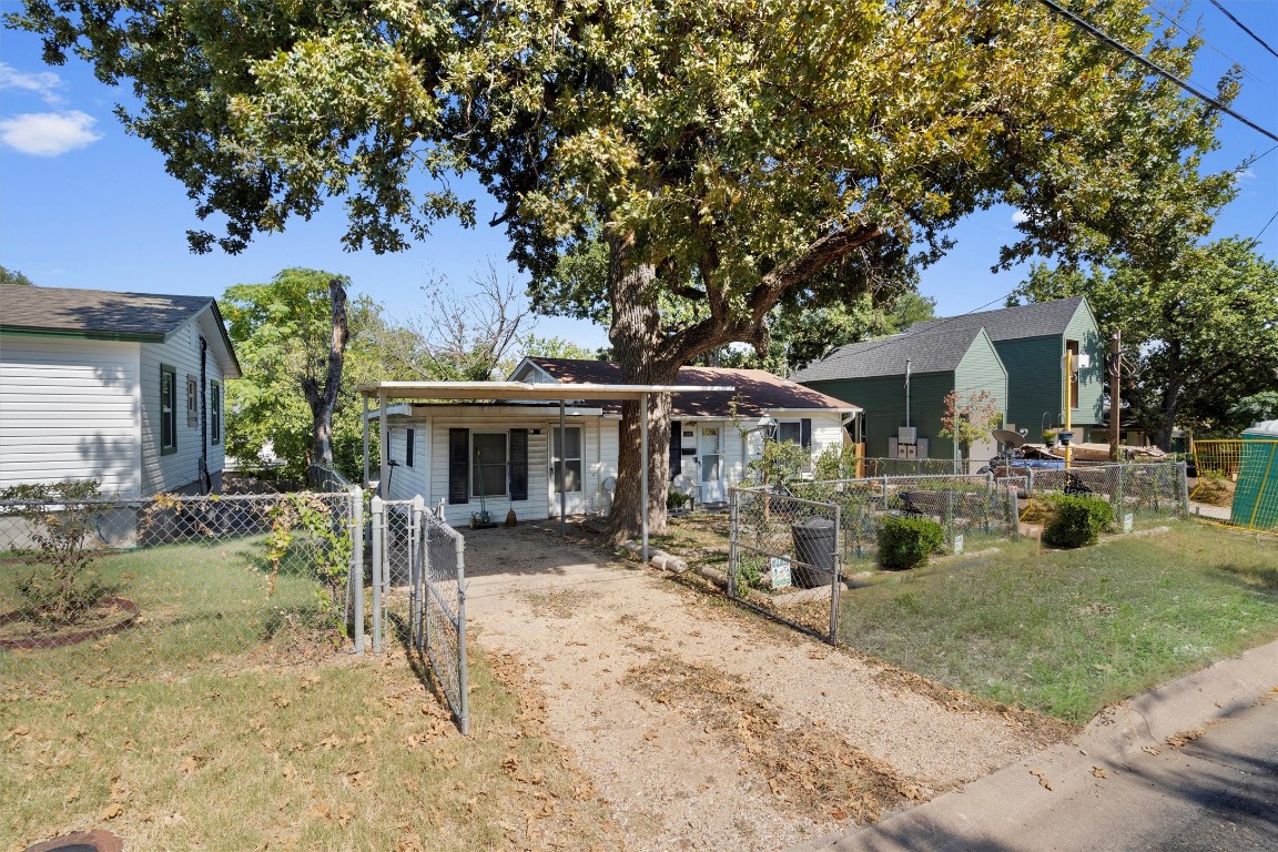 a view of a house with a yard patio and sitting area