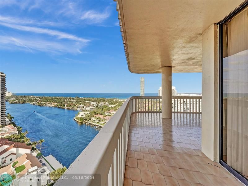 a view of a balcony with an ocean view